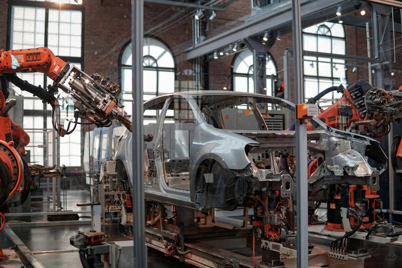 Robotic arms on an automotive assembly line