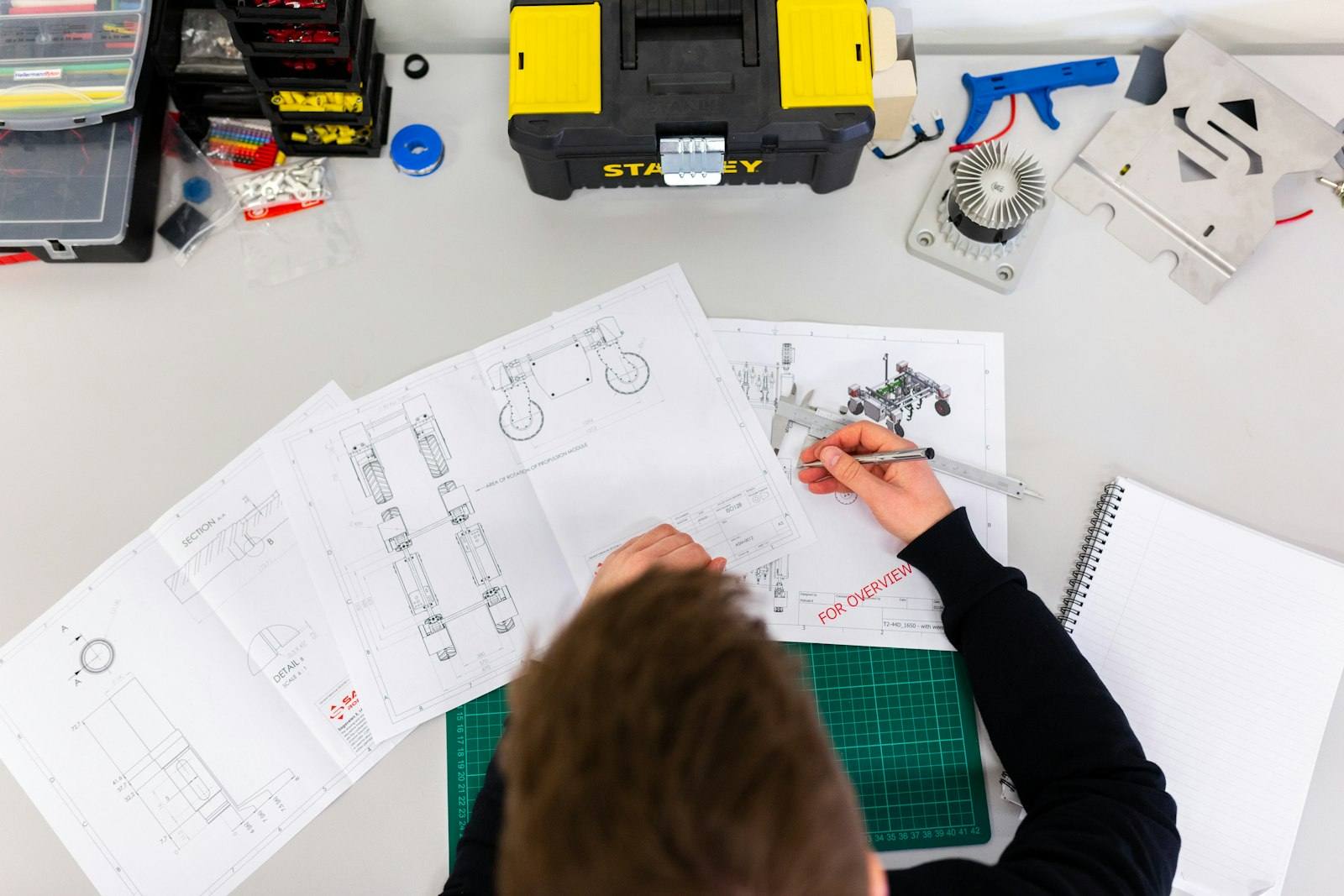Engineer annotating technical schematics